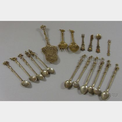 Eighteen Pieces of Italian and Venetian Brass and Metal Figural Flatware