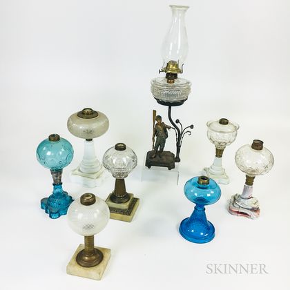 Nine Mostly Glass Oil Lamps