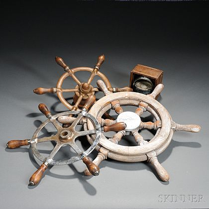 Three Ship's Wheels and a Ship's Compass