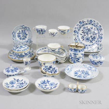 Extensive Meissen Blue Onion-pattern Porcelain Dinner Service. Estimate $1,000-1,500