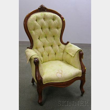 Victorian Rococo Revival Upholstered Carved Walnut Parlor Armchair. 