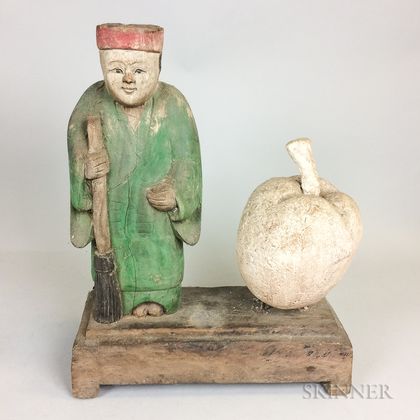 Carved and Polychrome Painted Figure and an Apple