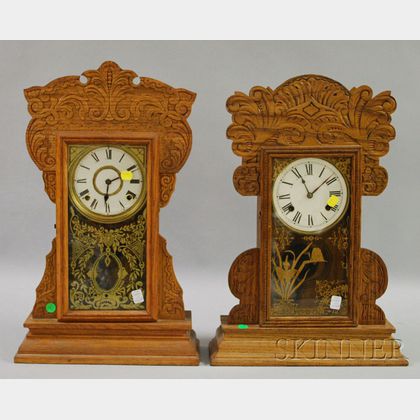 Two Late Victorian Pressed Oak Gingerbread Shelf Clocks. Estimate $100-150