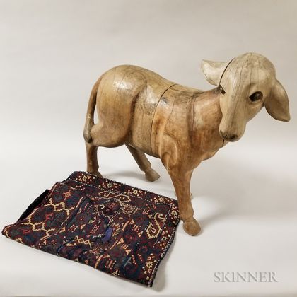 Large Carved Wood Sheep and a Woven Saddle Blanket