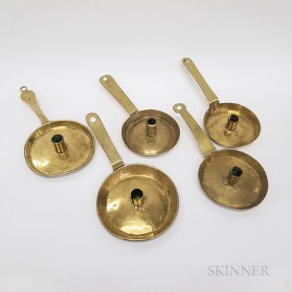 Five Early Brass Candleholders