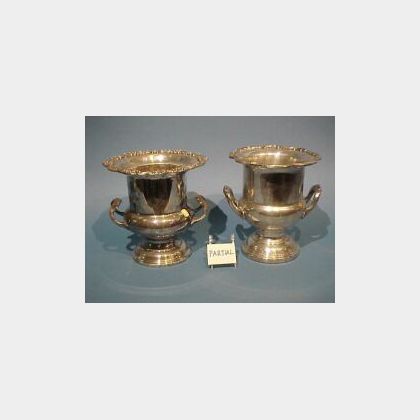 Two Silver Plated Champagne Buckets, Caster Set and a Brass and Wood Wine Tilt. 