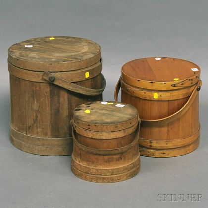 Three Covered Wooden Firkins with Swing Handles. Estimate $200-250