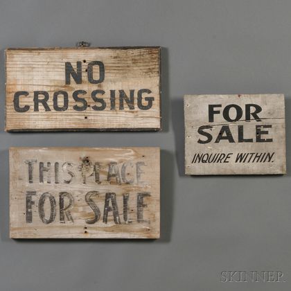 Three Black and White Painted Signs