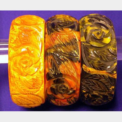 Set of Three Bakelite &#34;End of Day&#34; Carved Bangles