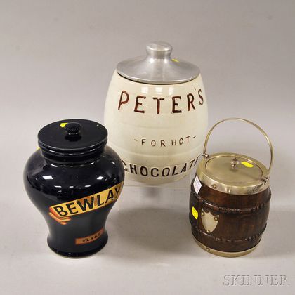 Two Tobacco Jars and a Ceramic "Peter's for Hot Chocolate" Barrel-form Urn