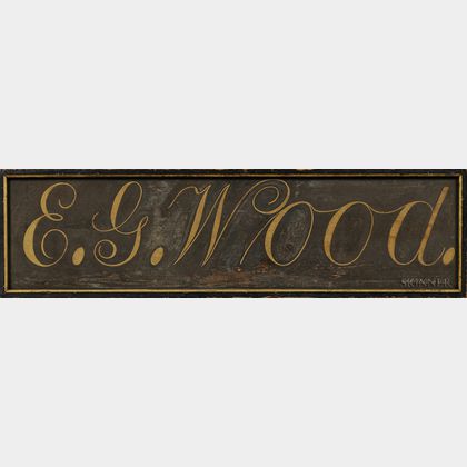 Painted "E.G. Wood." Sign