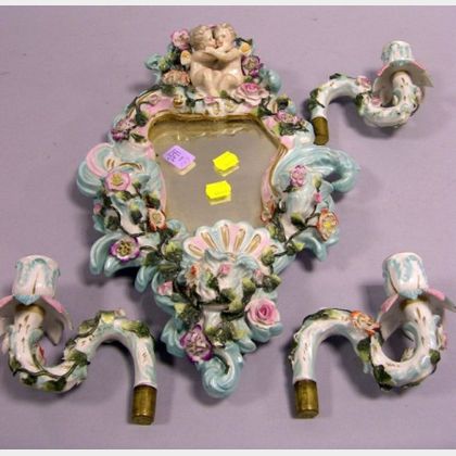 German Floral Encrusted and Cherub Figural Porcelain Mirrored Wall Sconce. 