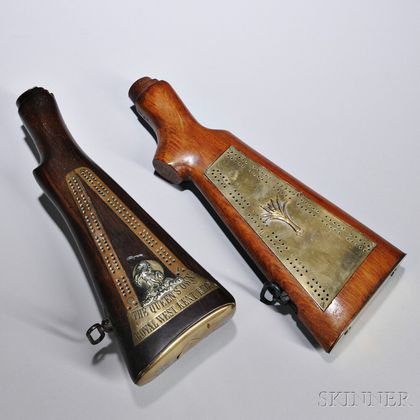 Two Gunstock Cribbage Boards, England, late 19th/early 20th century, both brass-mounted, one centering a cast brass leek, the other let