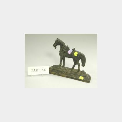 Black Painted Cast Iron Saddled Horse Doorstop and a Rococo-style Gilt Cast Iron