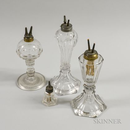 Four Colorless Pressed Glass Lamps