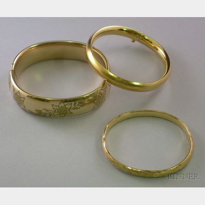 Two Gold-filled Bangles and One 14kt Gold Bangle. 
