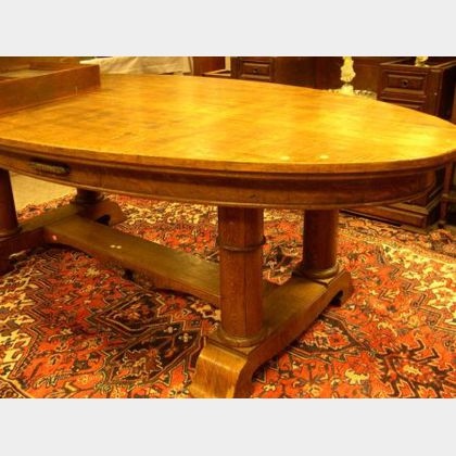 Large Early 20th Century Oval Oak Double Pedestal-base Center Table. 
