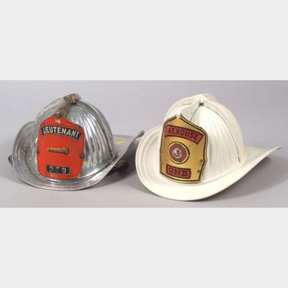 Two Metal Fire Helmets by Cairns & Brother