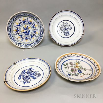 Four Delft and Delft-type Floral-decorated Ceramic Chargers