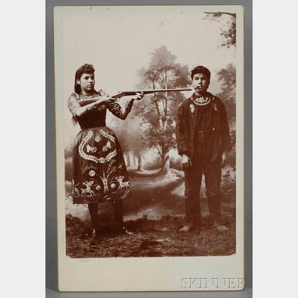 Cabinet Card Depicting a Female Sharpshooter, Possibly Annie Oakley
