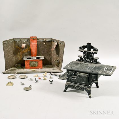 Crescent Cast Iron Toy Stove and a Pressed Tin Toy Stove. Estimate $20-200