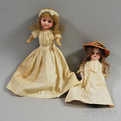 Two Small Bisque Head Girl Dolls