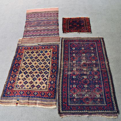 Four Baluch Rugs