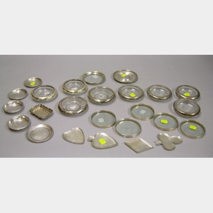 Twenty-five Sterling Silver and Mounted Colorless Glass Coasters and Nut Dishes