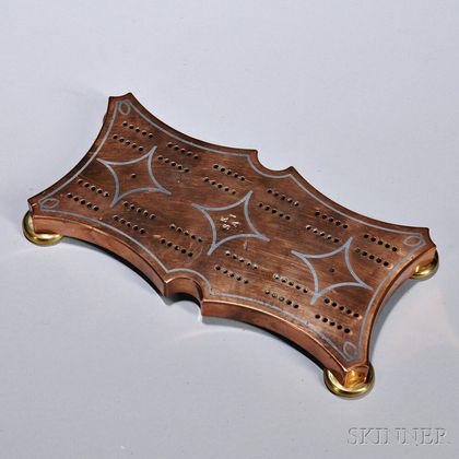 Bell Metal Cribbage Board, probably England, late 19th century, the shaped form inlaid with pewter border and shapes, die-stamped in th