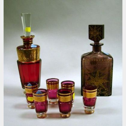 Bohemian Gilt Ruby Glass Decanter and a Set of Six Cordials, and a Bohemian Gilt Etched Amethyst Glass Decanter. 