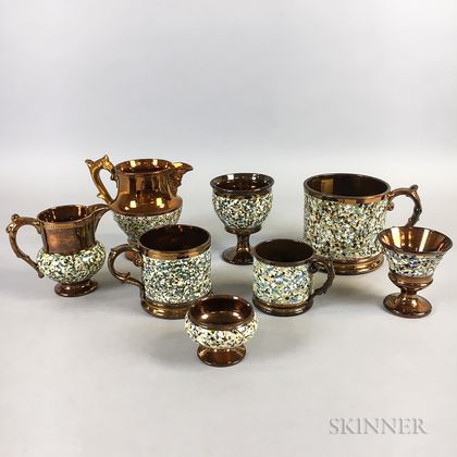 Eight Marbled Copper Lustre Ceramic Vessels