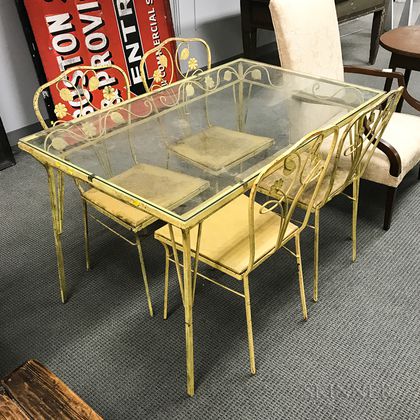 Yellow-painted Wrought Iron and Glass Patio Table and Four Chairs. Estimate $200-250