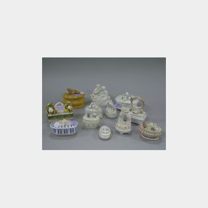 Twelve Porcelain Figural Trinket Boxes. 