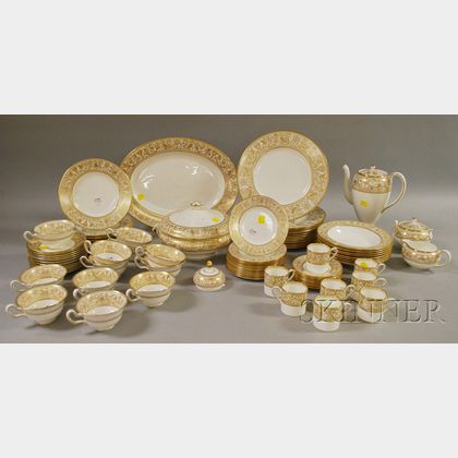 Eighty-piece Wedgwood Gold Florentine Pattern Porcelain Partial Dinner Service. Estimate $200-250