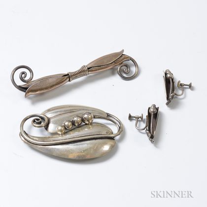 Two Attributed to Georg Jensen Inc. Sterling Silver Brooches and a Pair of Earrings