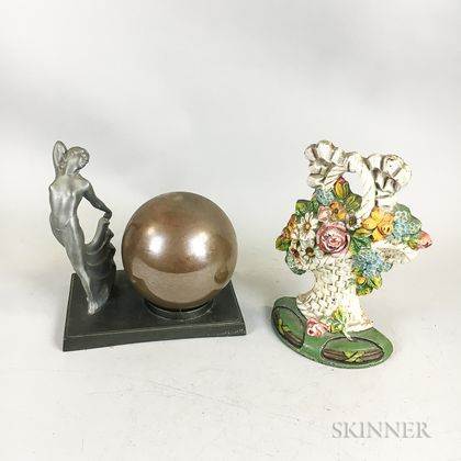 Polychrome Cast Iron Basket of Flowers Doorstop and an Art Deco White Metal Boudoir Lamp. Estimate $200-300