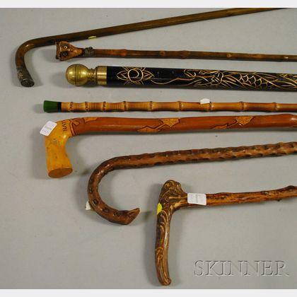 Seven Assorted Carved Walking Rootwood and Bamboo Walking Sticks and Canes