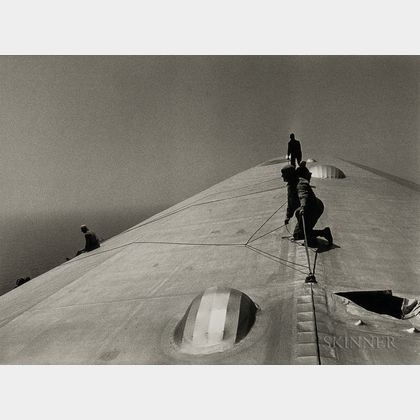 Alfred Eisenstaedt (American, 1898-1995) Repairing the Hull of the Graf Zeppelin During the Flight over the Atlantic