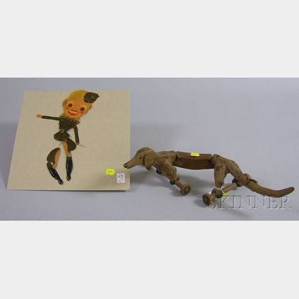 Carved and Painted Wood Articulated Dachshund Toy and a German Blonde WWII Military Painted Cardboard Articulat... 