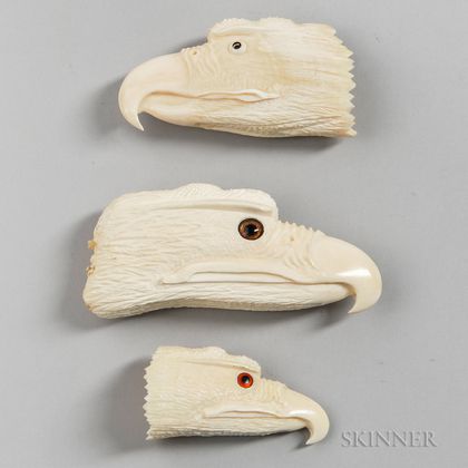 Three Carved Whale Ivory Eagle Heads