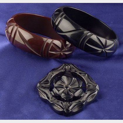 Two Bakelite Carved Bangles and Licorice Flower Brooch