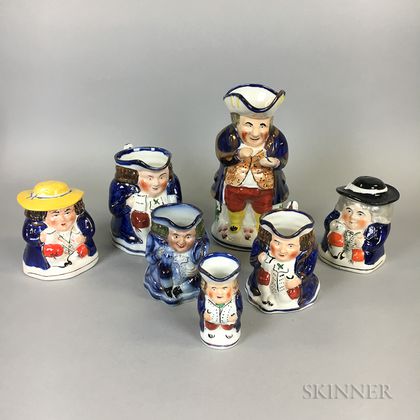 Seven Staffordshire Toby Jugs and Tobacco Jars
