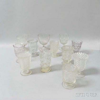 Twelve Colorless Pressed Glass Goblets and Spooners