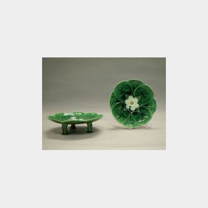 Pair of Majolica Pond Lily Compotes, late 19th century, with overlapping stylized lily leaves, and central lily flowerhead, on three sp
