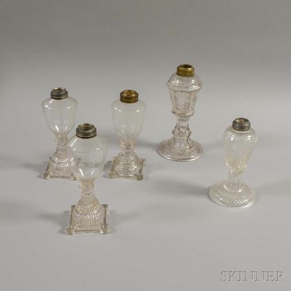 Five Colorless Pressed Glass Whale Oil Lamps. Estimate $200-400