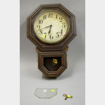 E. Ingraham 10 in. Ingot, Oak Cased Drop Octagon Wall Clock