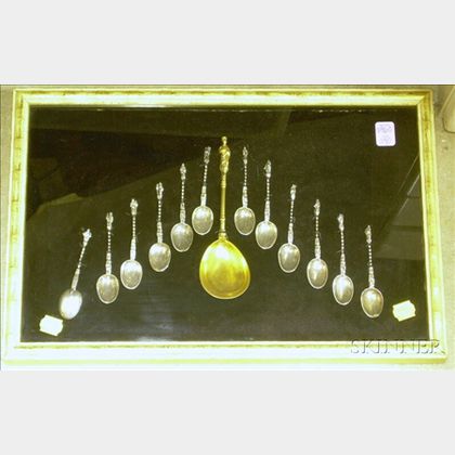 Framed Collection of Twelve Sterling Silver Apostle Spoons with a Gilt-metal Christ Spoon. 