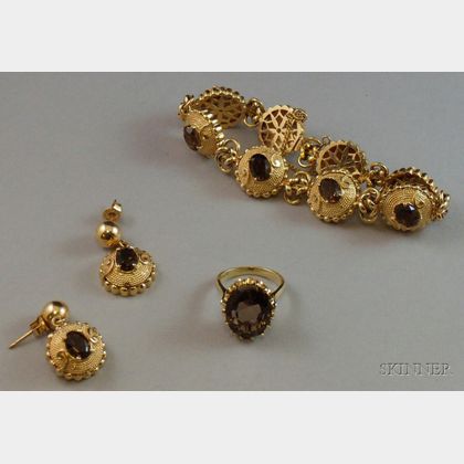 14kt Gold and Smokey Quartz Bracelet and Earrings Suite and a 14kt Gold and Smokey Quartz Ring. Estimate $300-500