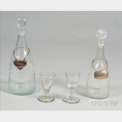 Two Early Blown Molded Colorless Glass Decanters with Two Wines