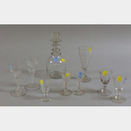 Eight Colorless Blown Glass Wine Stems and a Decanter